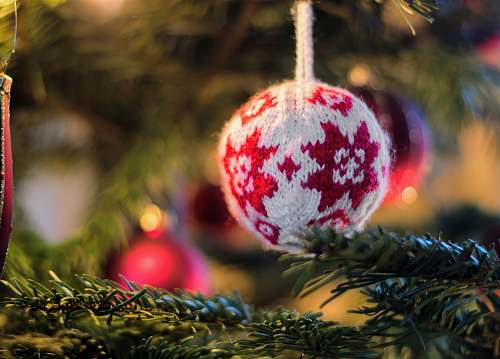 christmas tree white and red knit bauble on green Christmas tree ornament